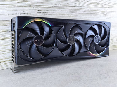 Triple fan GPU with RGB lighting, ideal for gaming setups and high-performance computing.