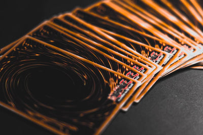 Close-up view of collectible trading cards in a fan arrangement, highlighting intricate patterns.