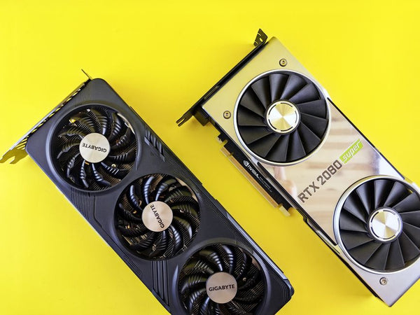 Two modern graphics cards on a bright yellow background, highlighting technology and design.