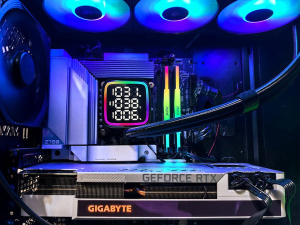 Vibrant RGB-lit gaming PC interior showcasing GeForce RTX and GIGABYTE components.