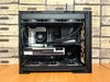 Detailed view of a custom-built gaming PC with visible components like graphics card and cooling system.