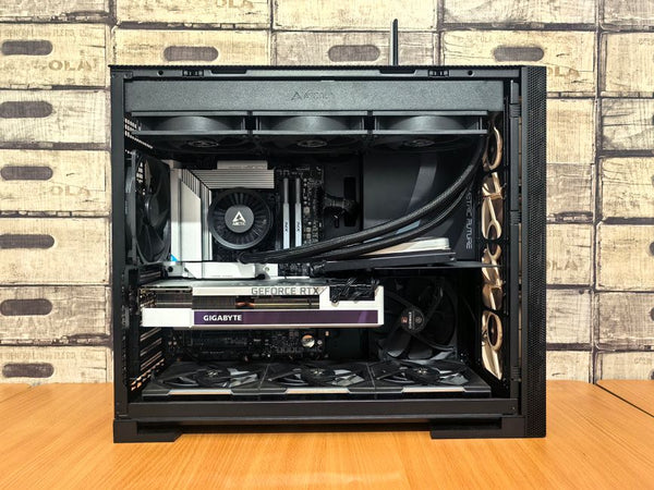 Detailed view of a custom-built gaming PC with visible components like graphics card and cooling system.