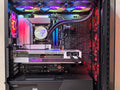 Inside view of a high-performance gaming PC showcasing components and vibrant RGB lighting.