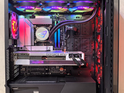 Inside view of a high-performance gaming PC showcasing components and vibrant RGB lighting.
