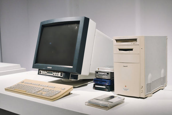 A retro computer setup featuring a classic CRT monitor and vintage CPU, showcasing technology history.