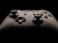 A detailed close-up of a modern gaming controller highlighting its design and functionality.